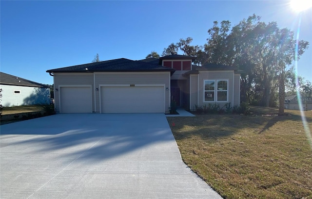 view of front facade featuring a garage and a front yard