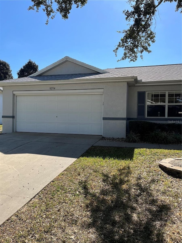 view of side of home featuring a garage