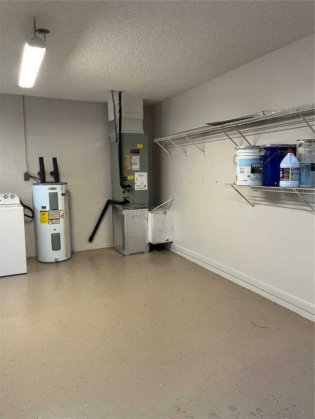 basement featuring washer / dryer, water heater, and a textured ceiling