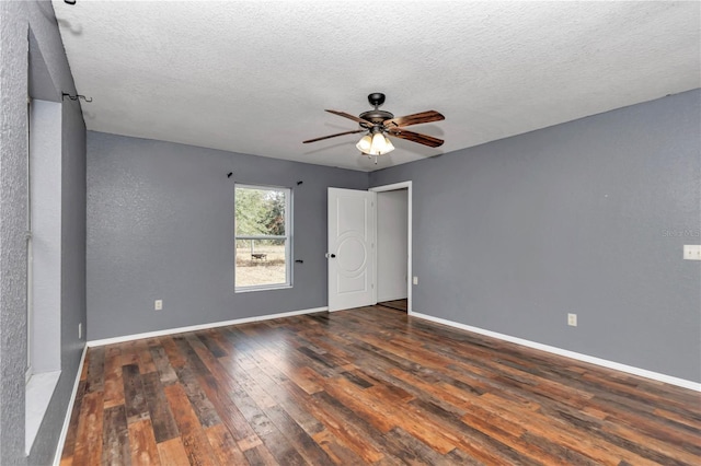 unfurnished room with dark wood-type flooring, a textured ceiling, and ceiling fan