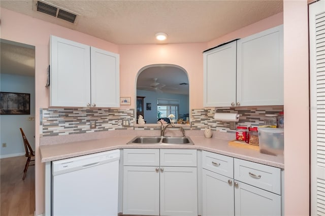 kitchen with sink, white cabinetry, and dishwasher