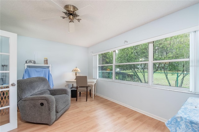 9051 SW 96th Ln Unit B, Ocala, FL 34481 - sitting room featuring light wood-style flooring, baseboards, and ceiling fan