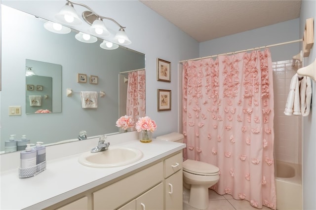 9051 SW 96th Ln Unit B, Ocala, FL 34481 - bathroom featuring toilet, tile patterned floors, vanity, a textured ceiling, and shower / bath combo with shower curtain