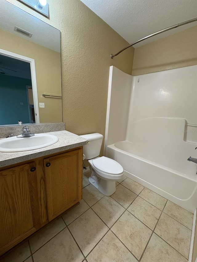 full bathroom with toilet, vanity, bathing tub / shower combination, and tile patterned floors