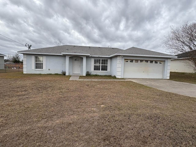 ranch-style house with a garage and a front yard