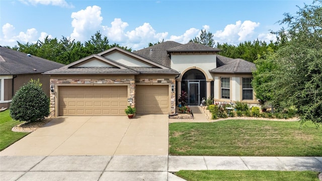 view of front facade featuring a front lawn and a garage