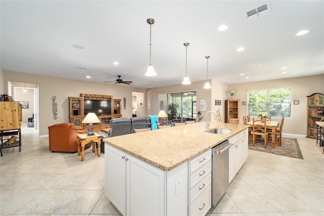 kitchen featuring sink, white cabinets, ceiling fan, and pendant lighting