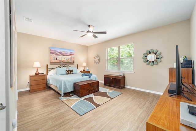 bedroom featuring ceiling fan and light hardwood / wood-style flooring