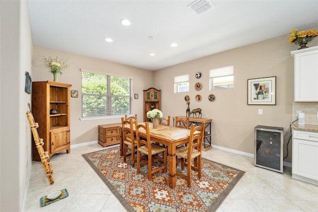 tiled dining space with beverage cooler