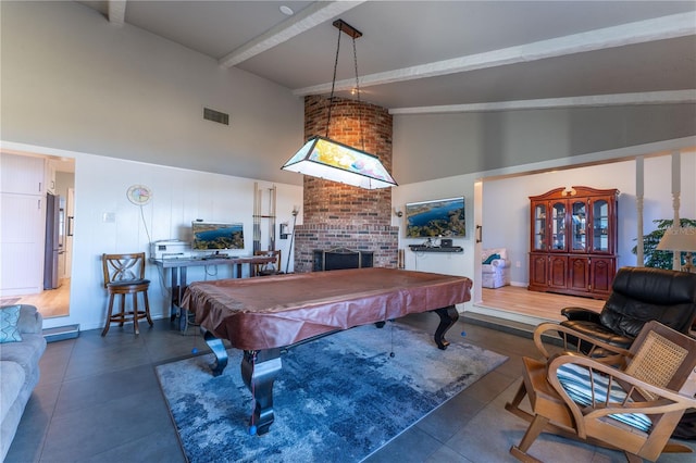 playroom with beamed ceiling, high vaulted ceiling, billiards, and a fireplace