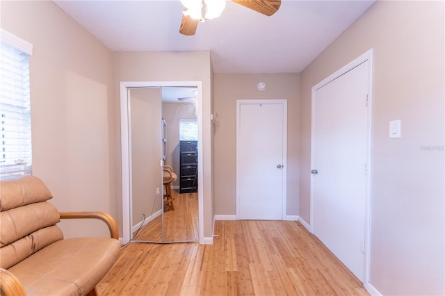 unfurnished room with ceiling fan and light wood-type flooring