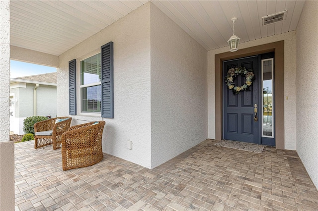 property entrance featuring a porch