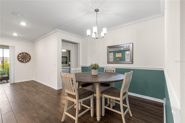 dining space featuring crown molding and a chandelier