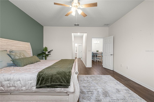 bedroom featuring ceiling fan and dark wood-type flooring