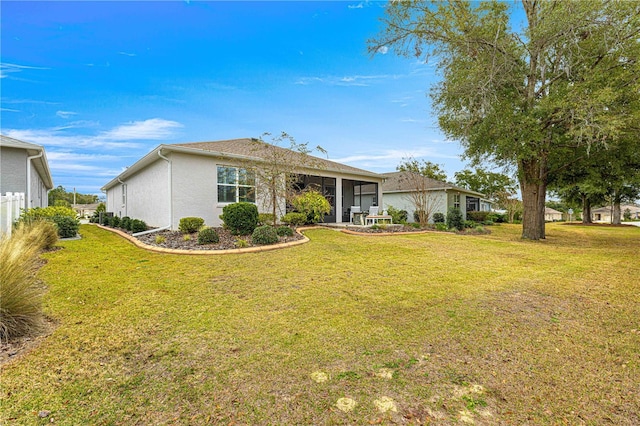 ranch-style home featuring a front lawn