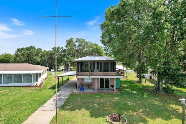 view of front of property with a front lawn and a sunroom