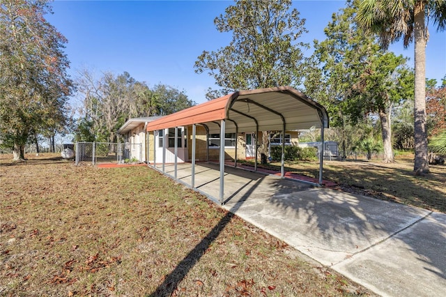 exterior space featuring a yard and a carport