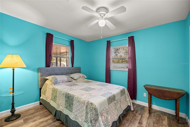 bedroom featuring ceiling fan and wood-type flooring