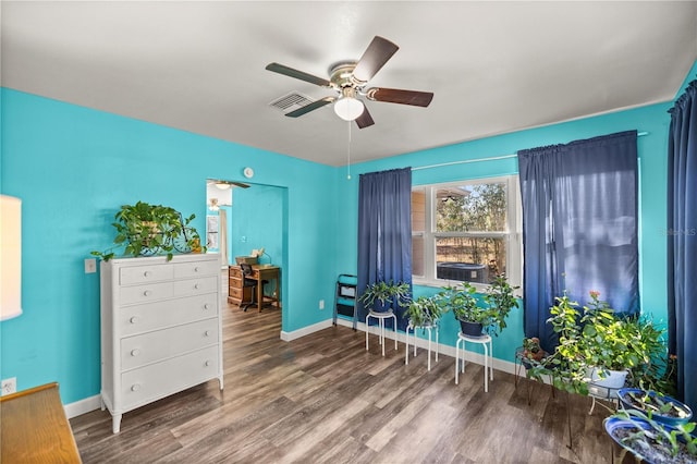 interior space featuring ceiling fan and wood-type flooring