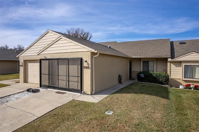 single story home with a front lawn and a garage