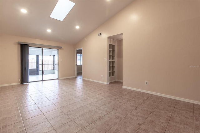 10918 SE 50th Ave, Belleview, FL 34420 - tiled empty room featuring high vaulted ceiling and a skylight