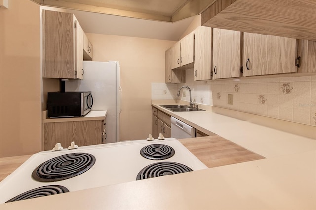 10918 SE 50th Ave, Belleview, FL 34420 - kitchen with backsplash, light brown cabinetry, dishwasher, range, and sink