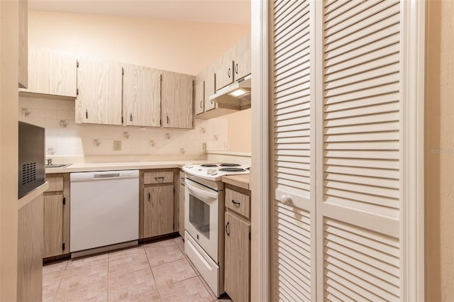 10918 SE 50th Ave, Belleview, FL 34420 - kitchen with decorative backsplash, white appliances, light tile patterned floors, and light brown cabinets