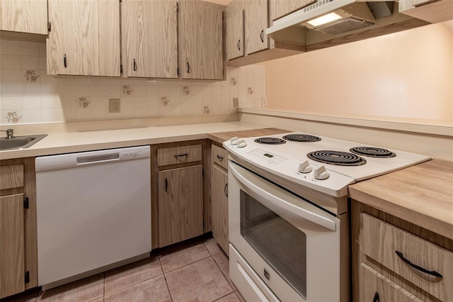 10918 SE 50th Ave, Belleview, FL 34420 - kitchen featuring light brown cabinetry, light tile patterned flooring, white appliances, and tasteful backsplash