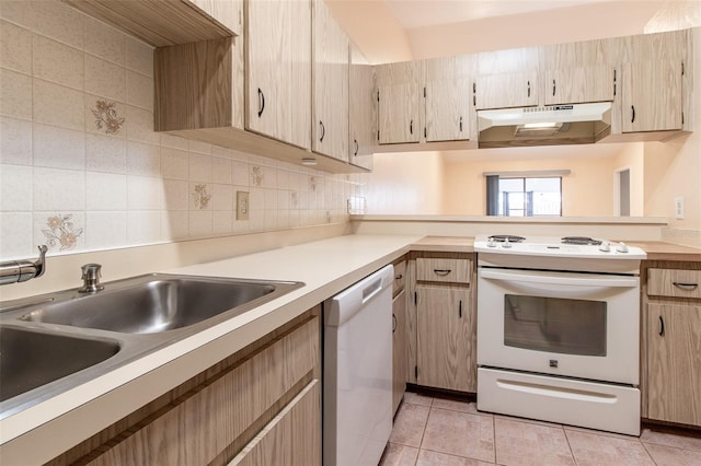 10918 SE 50th Ave, Belleview, FL 34420 - kitchen with white appliances, light brown cabinetry, sink, decorative backsplash, and light tile patterned floors