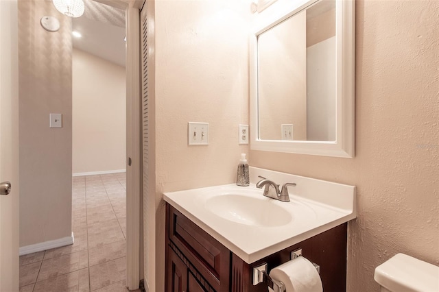 10918 SE 50th Ave, Belleview, FL 34420 - bathroom with toilet, vanity, and tile patterned flooring