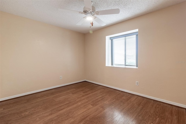 10918 SE 50th Ave, Belleview, FL 34420 - unfurnished room with a textured ceiling, ceiling fan, and wood-type flooring