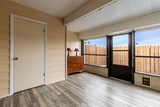 10918 SE 50th Ave, Belleview, FL 34420 - interior space featuring light wood-type flooring and wood walls