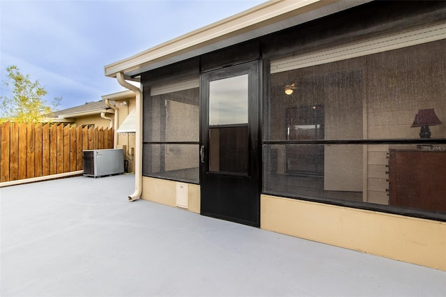 10918 SE 50th Ave, Belleview, FL 34420 - view of exterior entry featuring cooling unit and a patio