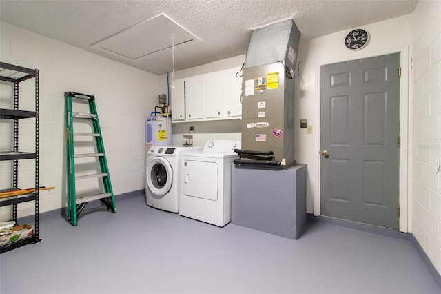 10918 SE 50th Ave, Belleview, FL 34420 - laundry room featuring a textured ceiling, water heater, washing machine and dryer, cabinets, and heating unit