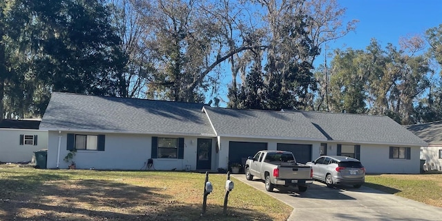 single story home with a garage and a front yard