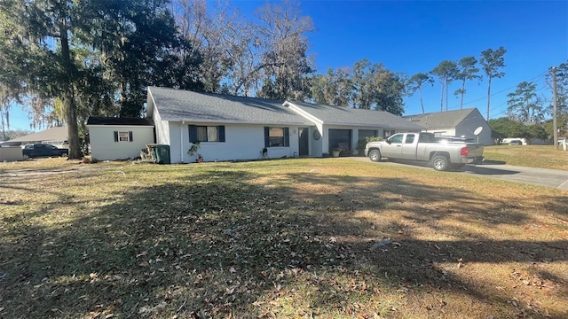 ranch-style house with a front yard