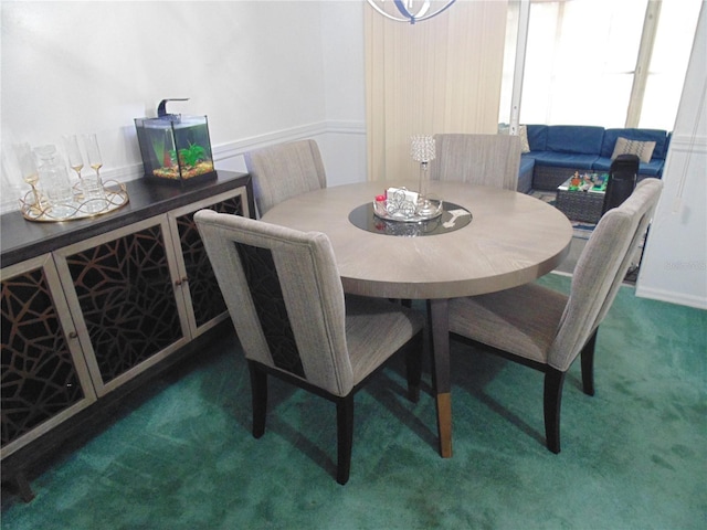 dining room featuring dark carpet