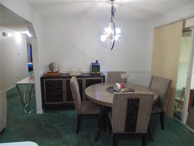 dining space featuring dark colored carpet