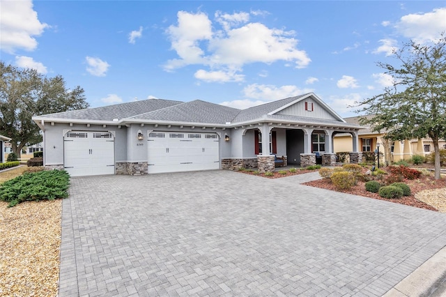 view of front of house featuring a garage and a porch