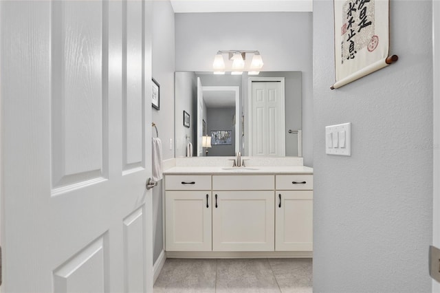 bathroom featuring tile patterned floors and vanity