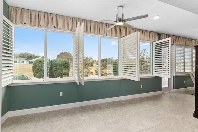 spare room with ceiling fan