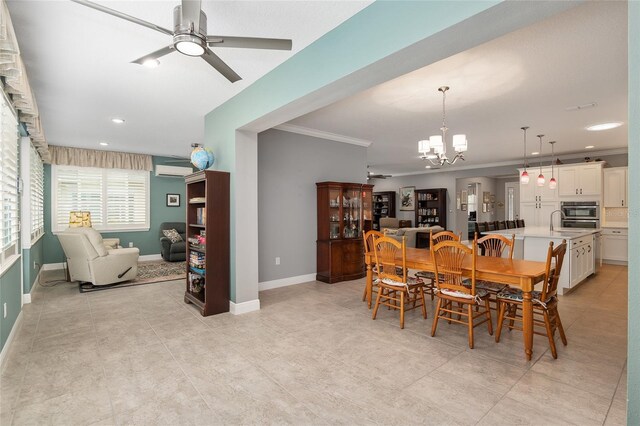 dining room with ceiling fan with notable chandelier, ornamental molding, and a wall mounted AC