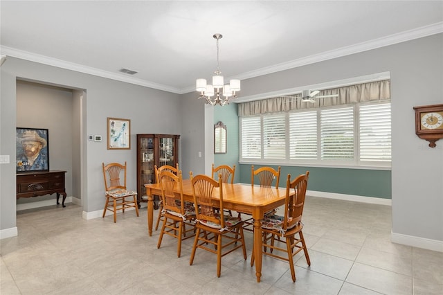 dining space featuring light tile patterned floors, crown molding, and a chandelier