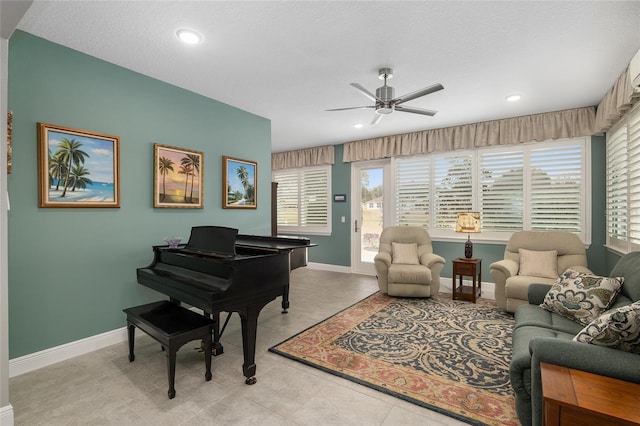 living area with ceiling fan