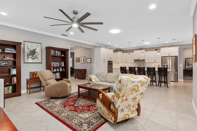 living room with ceiling fan, ornamental molding, and light tile patterned flooring