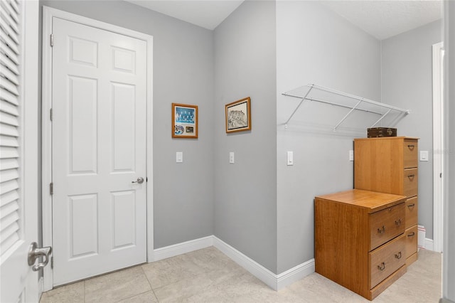 washroom with light tile patterned floors