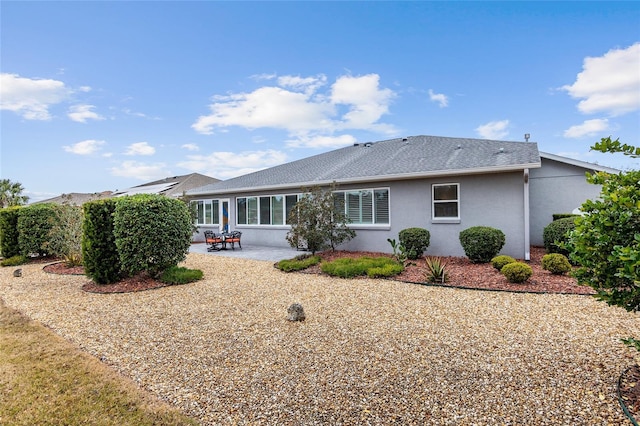 rear view of house with a patio area