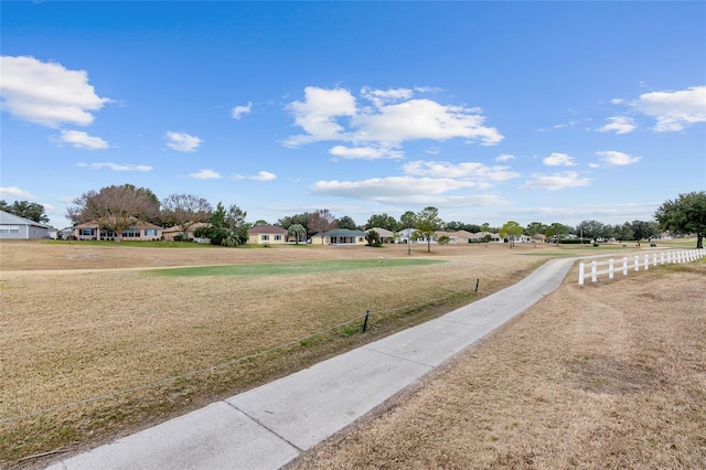 surrounding community featuring a yard