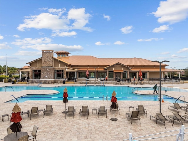 view of swimming pool featuring a patio