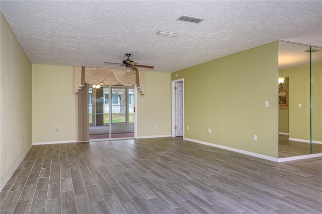 unfurnished room with a textured ceiling, ceiling fan, and hardwood / wood-style flooring